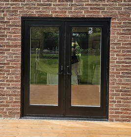 Outswing black garden door with custom size glass