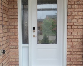 White-front-door-with-sidelite-3:4-glass.jpeg
