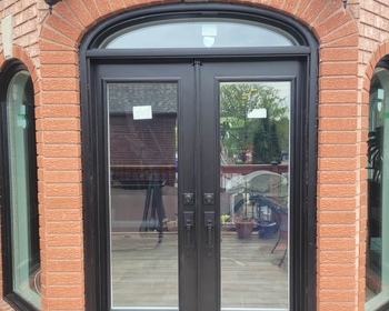 Black-french-door-with-arched-transom.jpeg