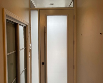 8'-high-modern-front-steel-door-with-frosted-glass-sidelite-and-transom-inside.jpg