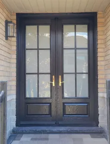 8' high black fiberglass door with 22x64- frosted glass with SDL grills.jpg