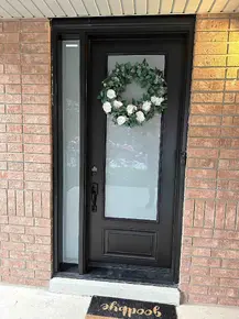 8' high steel black door with 22x64- frosted glass and frosted glass sidelite.jpg