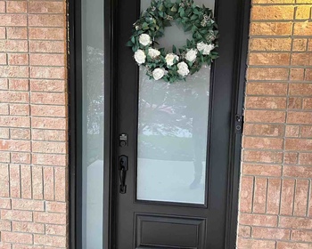 8' high steel black door with 22x64- frosted glass and frosted glass sidelite.jpg