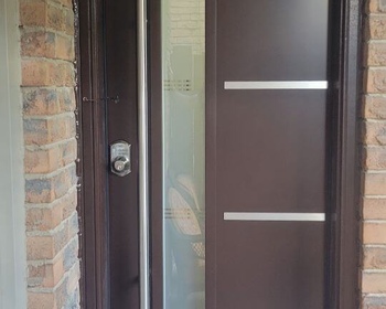 Brown Modern Steel door with 7x64- Oso glass and Steel line accents with pull bar handle.jpg