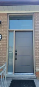 Grey steel Vog door with Beige frame sidelite and transom.jpg