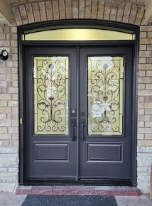 Double-door-with-22x48-inches-wrought-iron-glass-and-eyebrow-transom.JPG