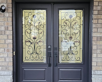 Double-door-with-22x48-inches-wrought-iron-glass-and-eyebrow-transom.JPG