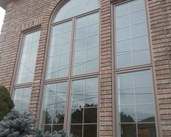 Large Front Vinyl Windows with Grills Brick to Brick