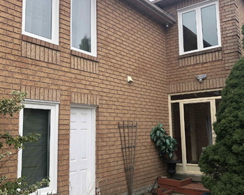 White Casement Windows with Brick in Brampton