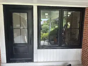 Black front door & black front window with cross grills.jpg
