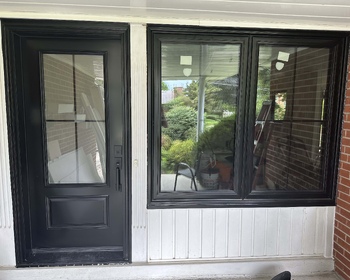 Black front door & black front window with cross grills.jpg