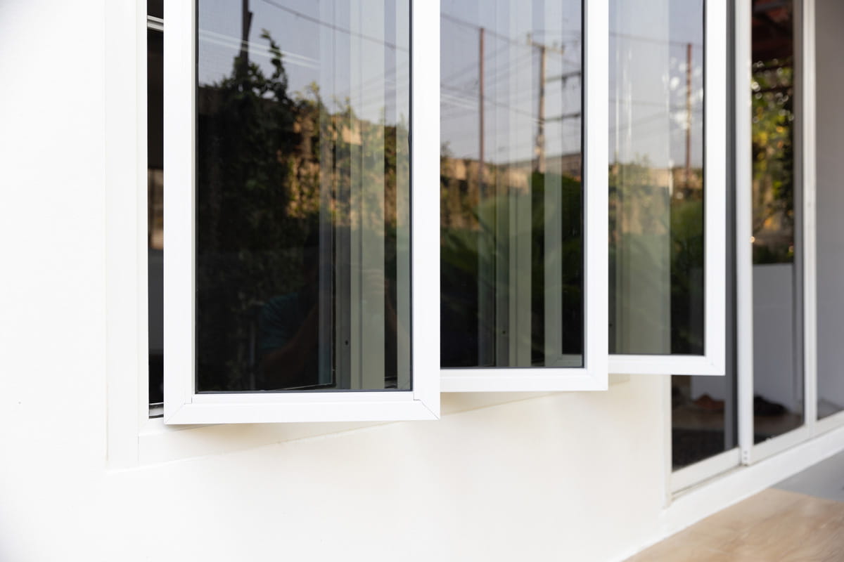 Casement window for ventilation and egress Side-hinged casement windows opened outward up to 90 degrees for ventilation and egress compliance in Ontario.