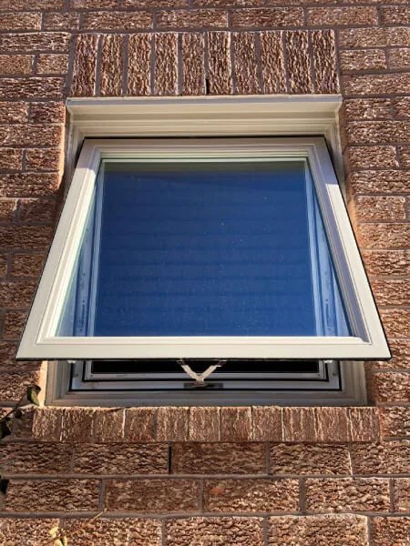 Awning replacement windows open outward providing ventilation in Toronto home