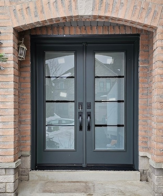Vinyl Light installation team fitting a custom fibreglass entry door in the GTA