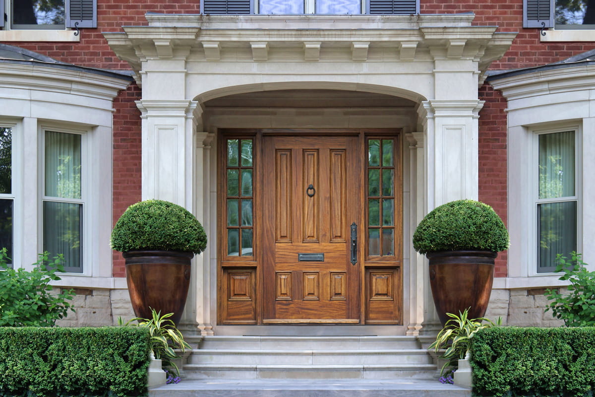 Custom front door entrance with enhanced design details, showing how sidelights and upgrades increase front door cost in Ontario.