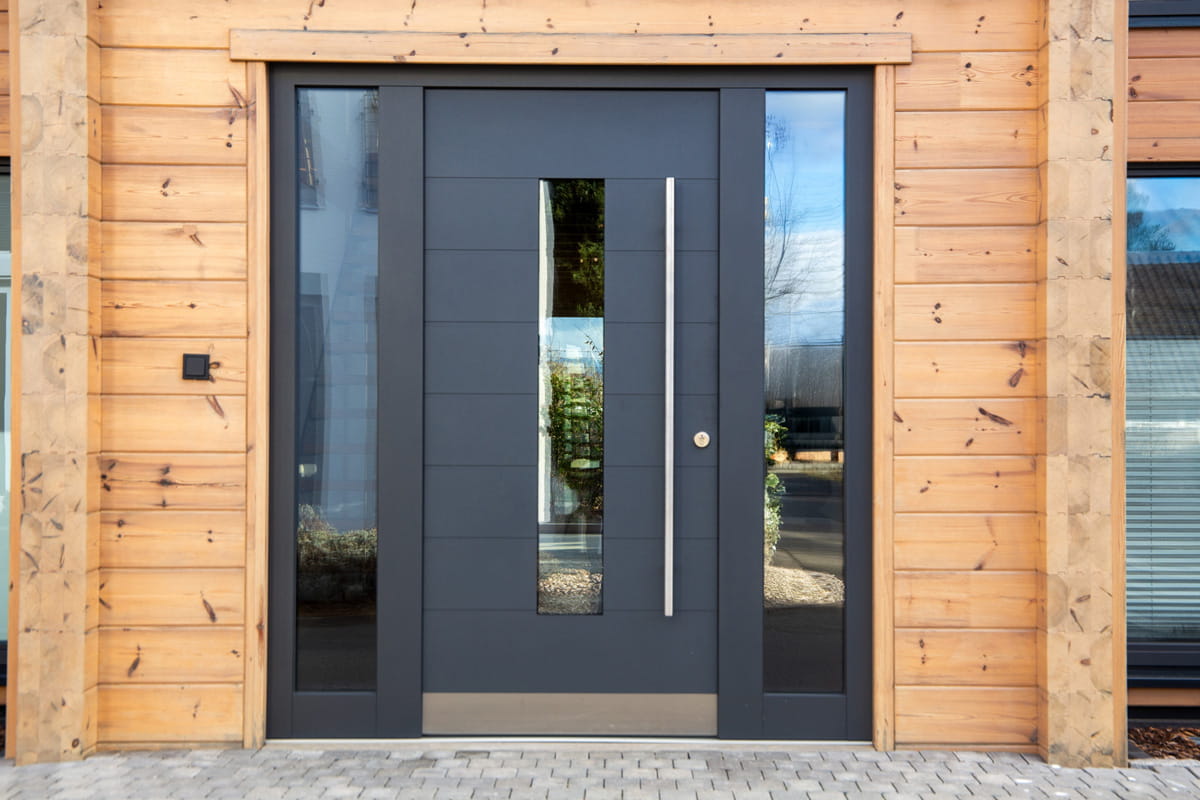Modern insulated front door with a tight seal, illustrating energy-efficient entry door upgrades for Ontario winters.