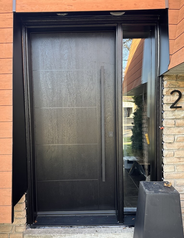 Modern fibreglass front door on a house entrance, highlighting mid-range front door cost and energy efficiency in Ontario.