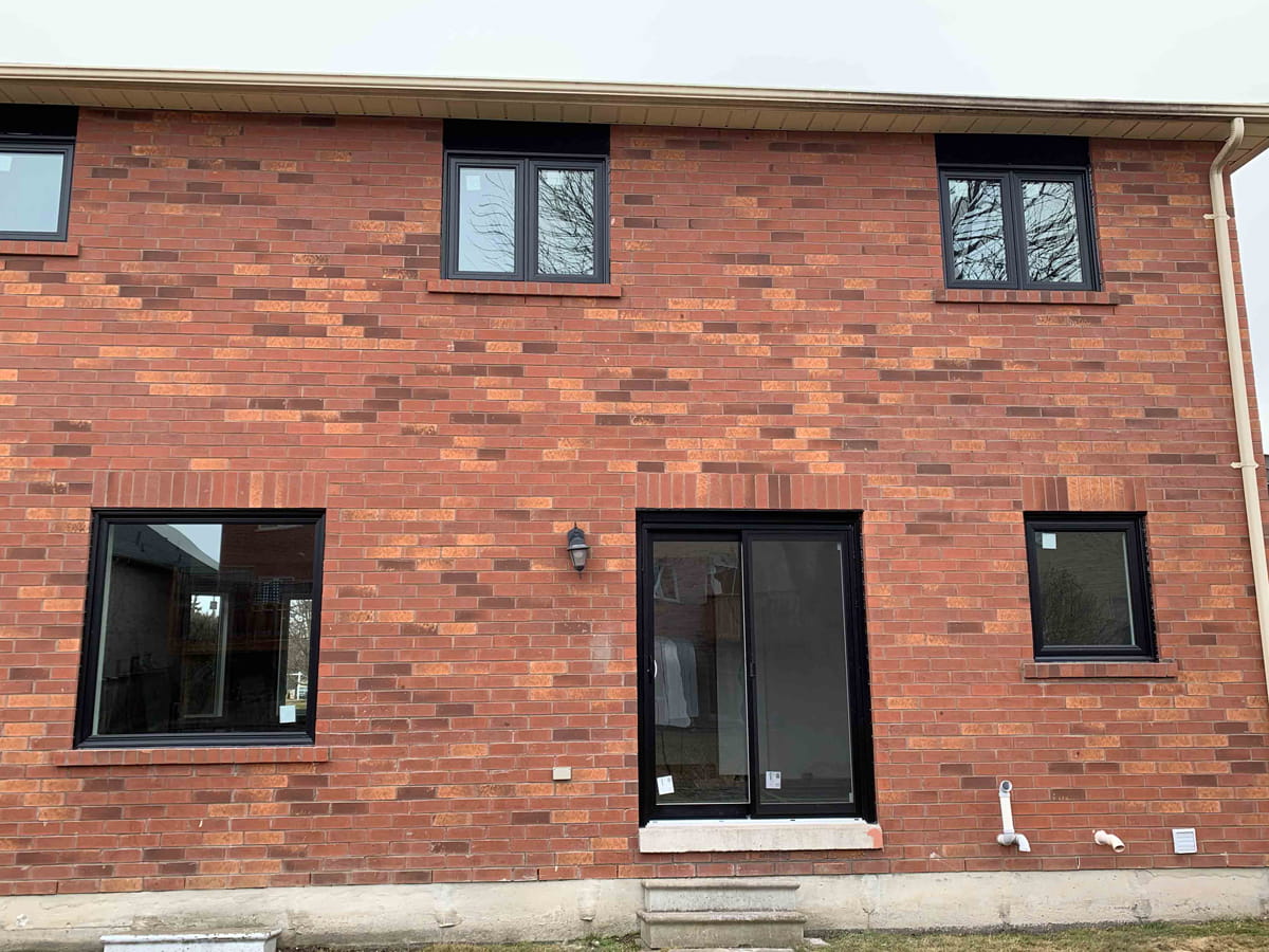 Modern Black Vinyl Windows Black vinyl windows installed on a modern home showing their contemporary exterior appearance